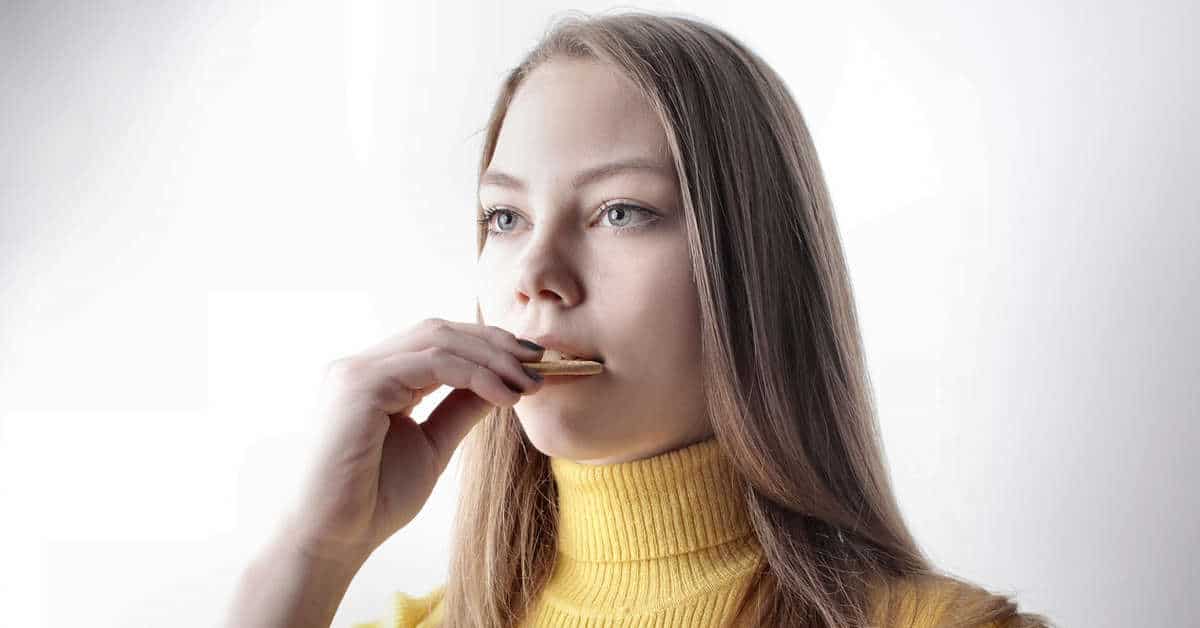 Woman eating a cookie