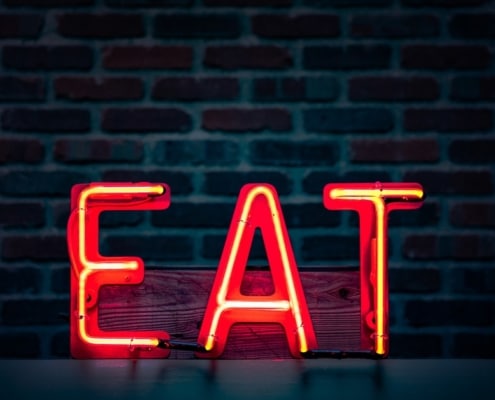 Neon sign that says EAT