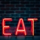 Neon sign that says EAT