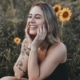 Happy girl in sunflower field