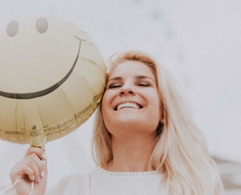 Girl smiling with balloon