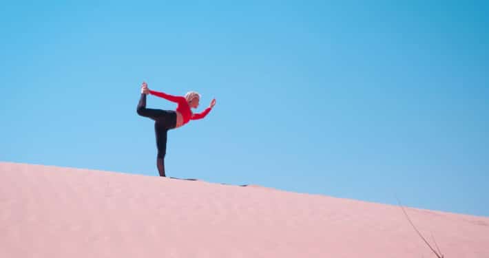 Woman doing yoga in the desert